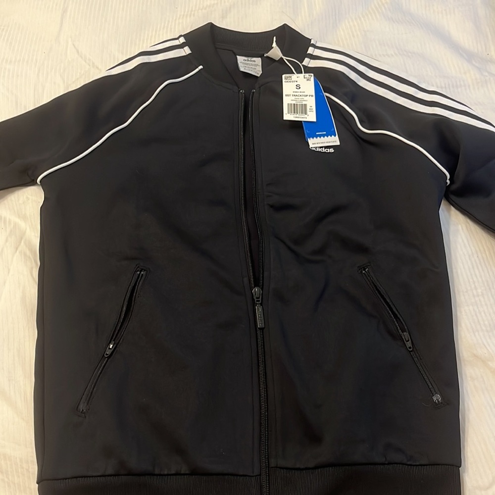 Adidas womens track jacket. Never worn. Good condition